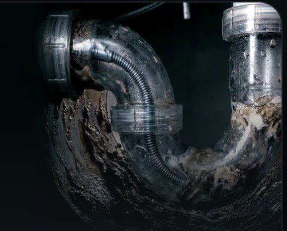 Grease and buildup cleared from a drain trap